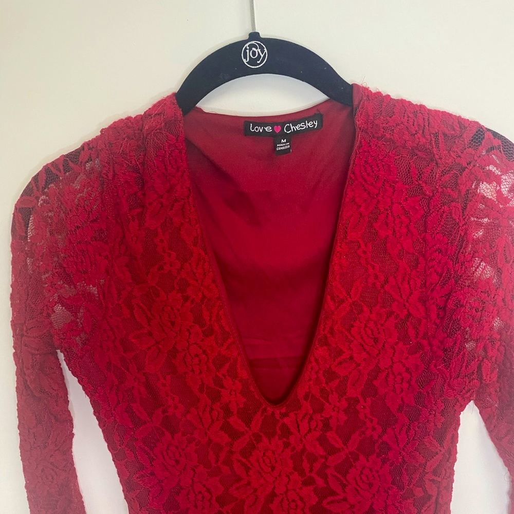 Red mesh dress, with long arms .Size M stretchy material.